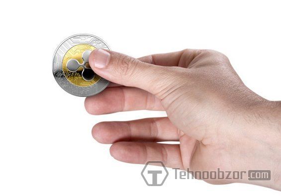 Монетка Ripple в руці
