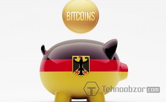 Монета Bitcoin падає в скарбничку з німецьким прапором