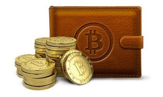 Монети біткоіни лежать біля гаманця
